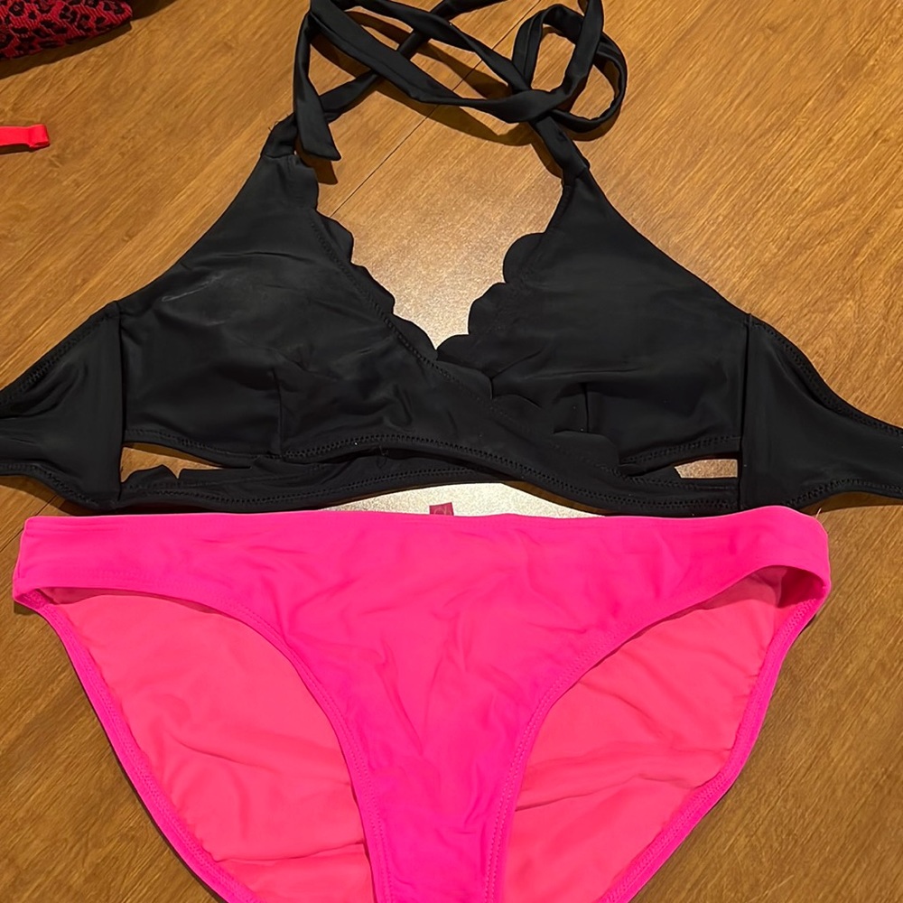 Black top pink bottom swimsuit